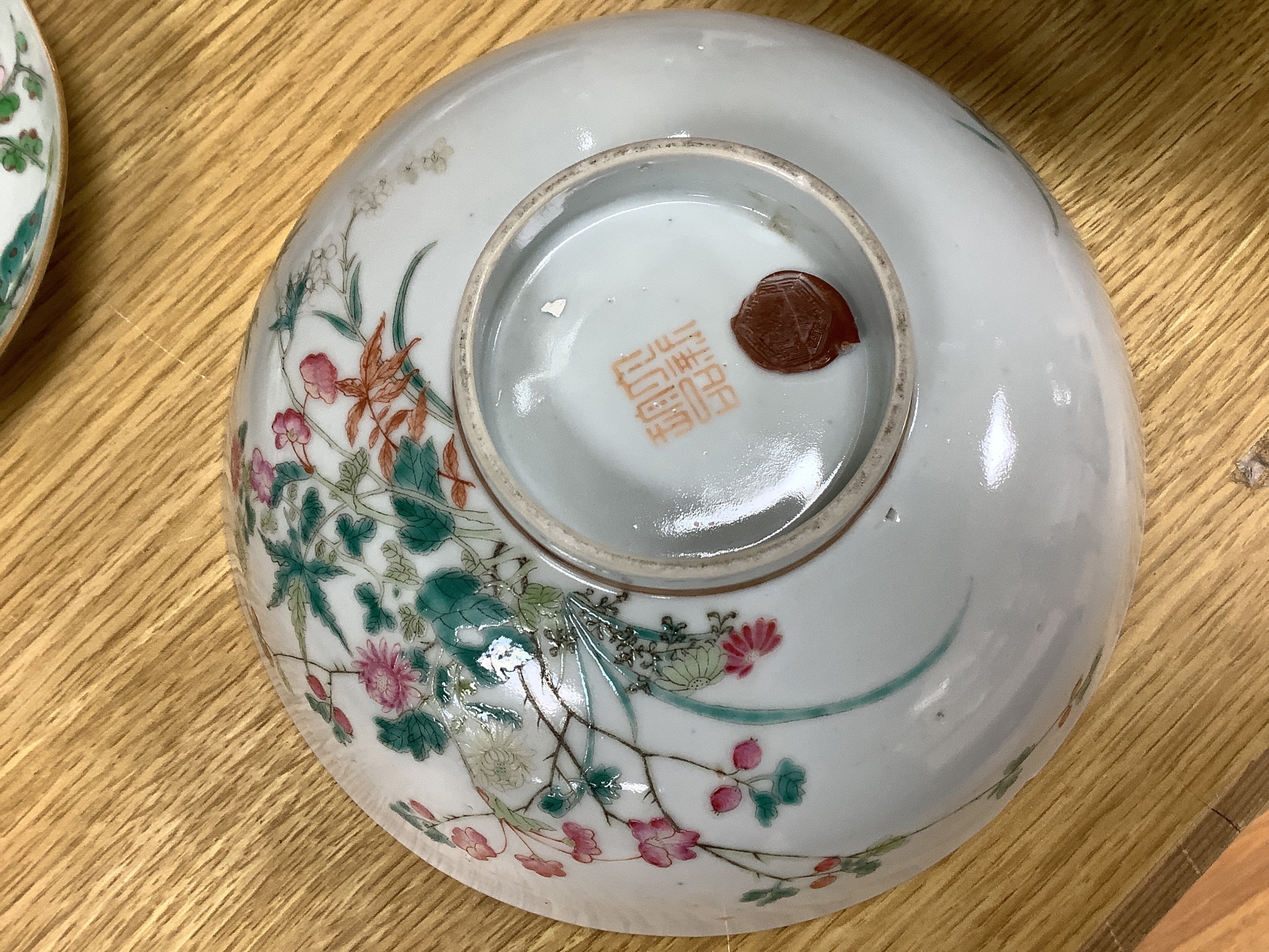 A 19th century Chinese famille rose bowl, two saucers and two 18th century Chinese famille rose plates 23cm